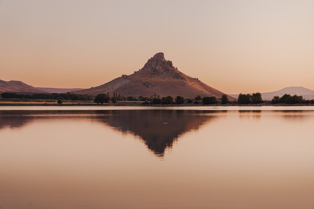 Calm mountain lake at sunrise, Lumara Integrative Health, integrative mental health and chronic illness therapy.